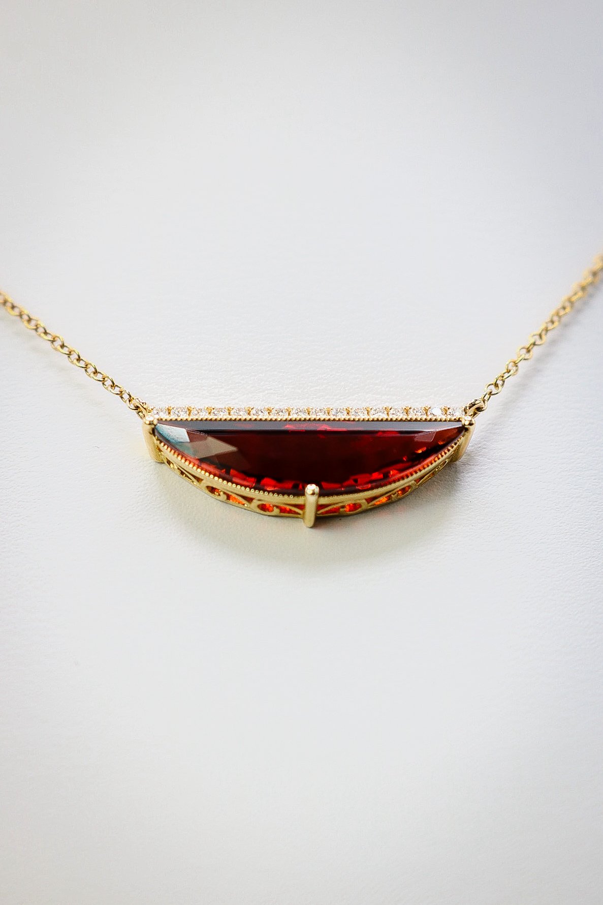 Garnet and diamond bar necklace on a fine gold chain